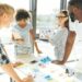 Trace the tendency. Cheerful enthusiastic young people discussing their business project and working together while expressing their ideas