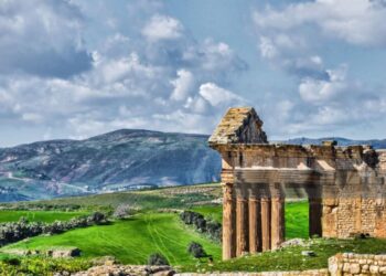 The archaeological site of Thugga/Dougga is located in the North-west region of Tunisia, perched on the summit of a hill at an altitude of 571 m, dominating the fertile valley of Oued Khalled. The impressive ruins give an idea of the resources of a Romanised Numidian town.