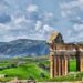 The archaeological site of Thugga/Dougga is located in the North-west region of Tunisia, perched on the summit of a hill at an altitude of 571 m, dominating the fertile valley of Oued Khalled. The impressive ruins give an idea of the resources of a Romanised Numidian town.