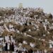 Muslim pilgrims gather to pray at Jabal al-Rahmah, also known as Mount Arafat, during the annual hajj pilgrimage, outside the holy city of Mecca, Saudi Arabia, June 5, 2025. REUTERS/Khaled Abdullah
